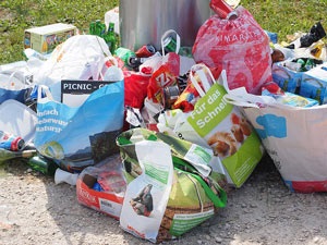 pile-of-trash-outside-a-can