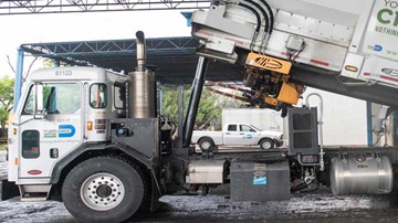 garbage truck unloading at a transfer station