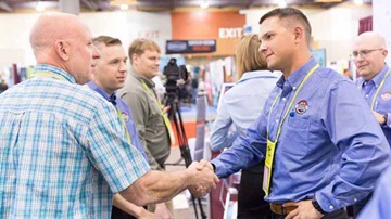 Exhibitor shaking hands