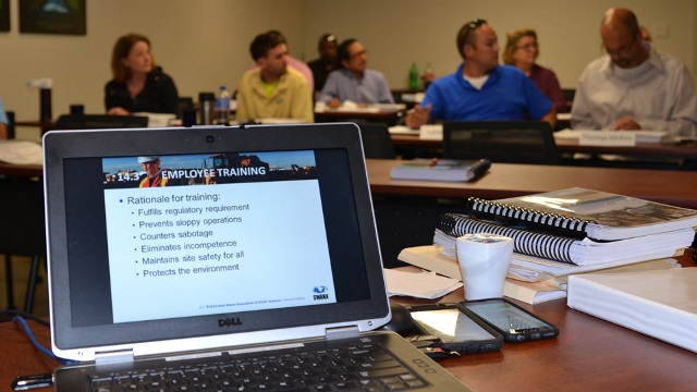 Laptop screenshot with students in background